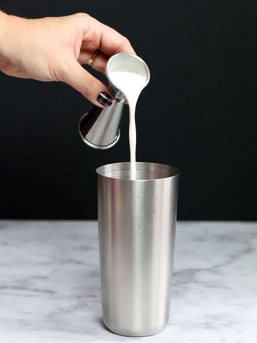 Cream being pour into a cocktail shaker