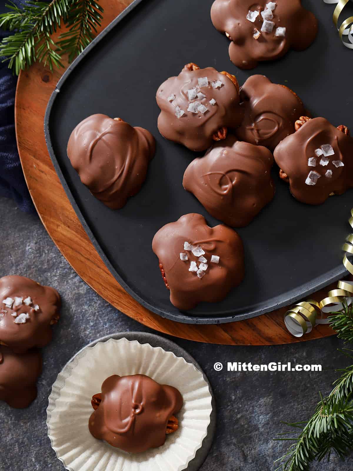 Chocolate Pecan Turtles on a platter. 