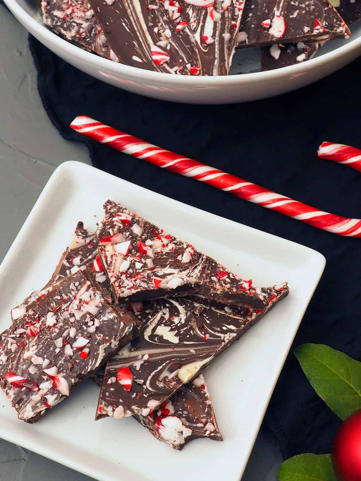 Finished peppermint candy cane bark on a plate. 