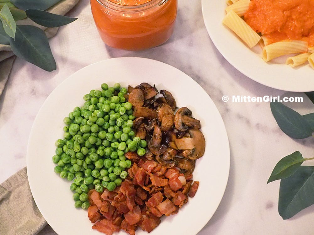 A plate of bacon, peas and mushrooms for sauce mix ins