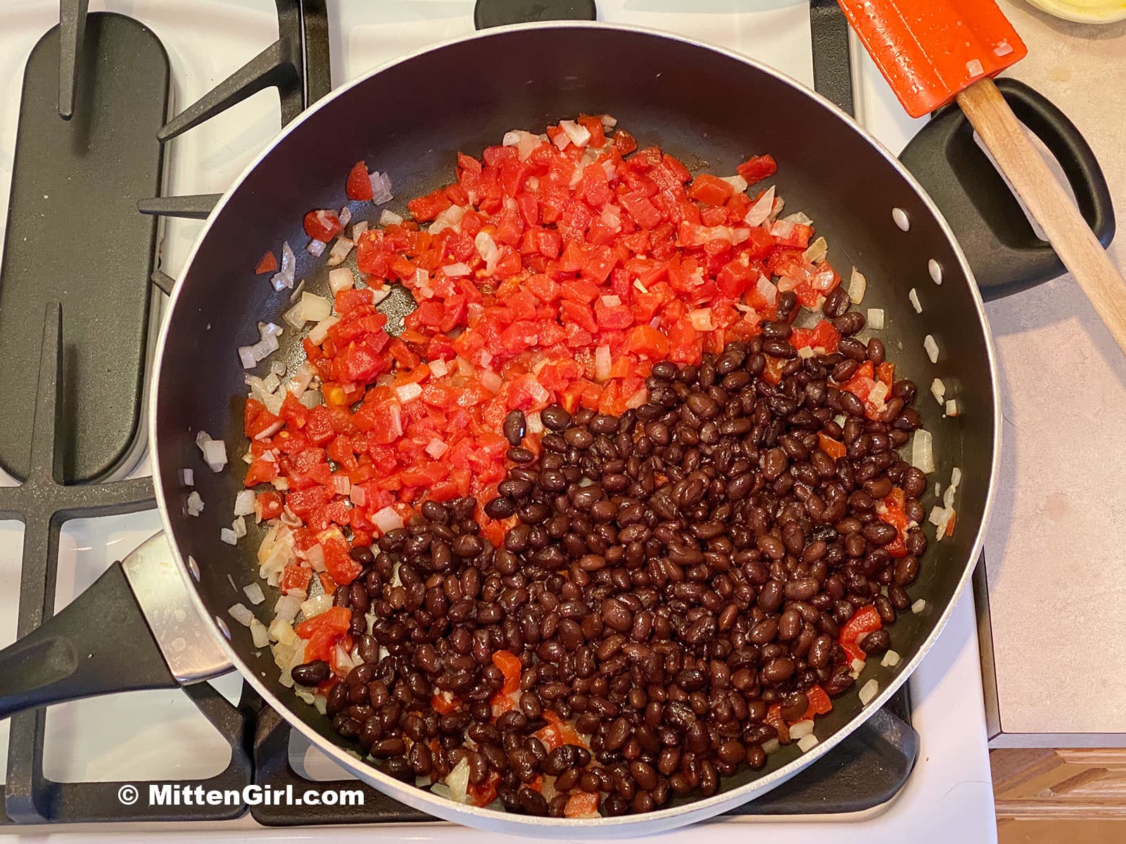Tomatoes and black beans in a skillet