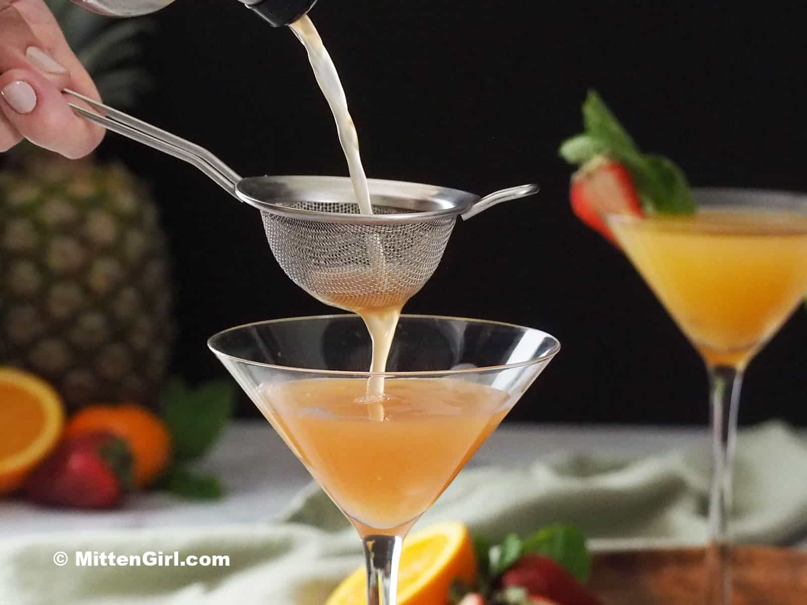Pouring a Strawberry Pineapple Vanilla Vodka Martini