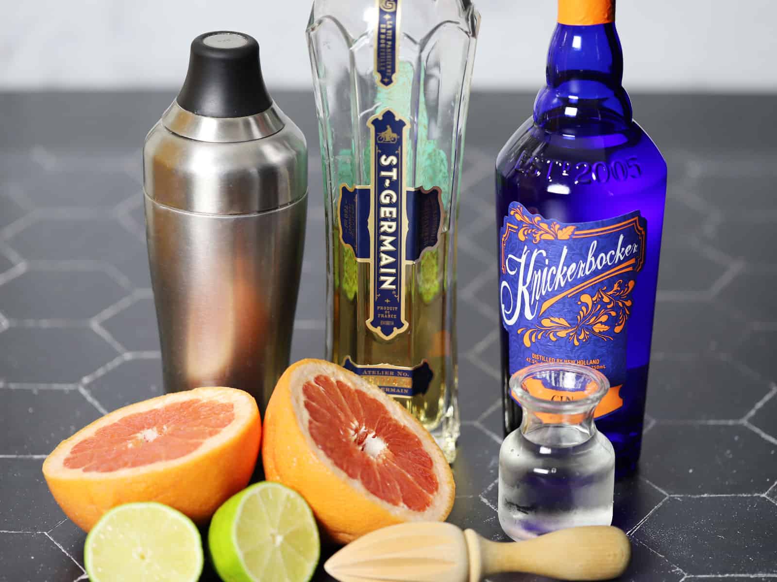 Ingredients and tools for grapefruit and elderflower cocktails