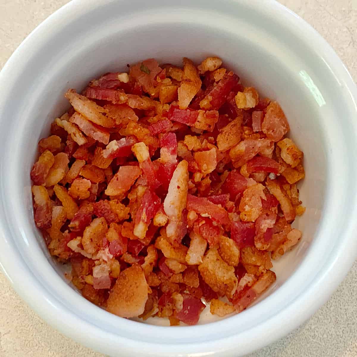 Cooked, diced bacon in a dish