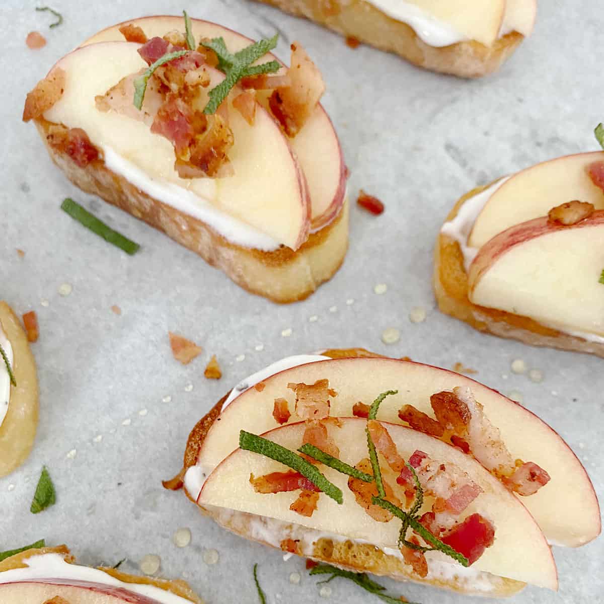 Apple, bacon, and goat cheese crostini ready to be served