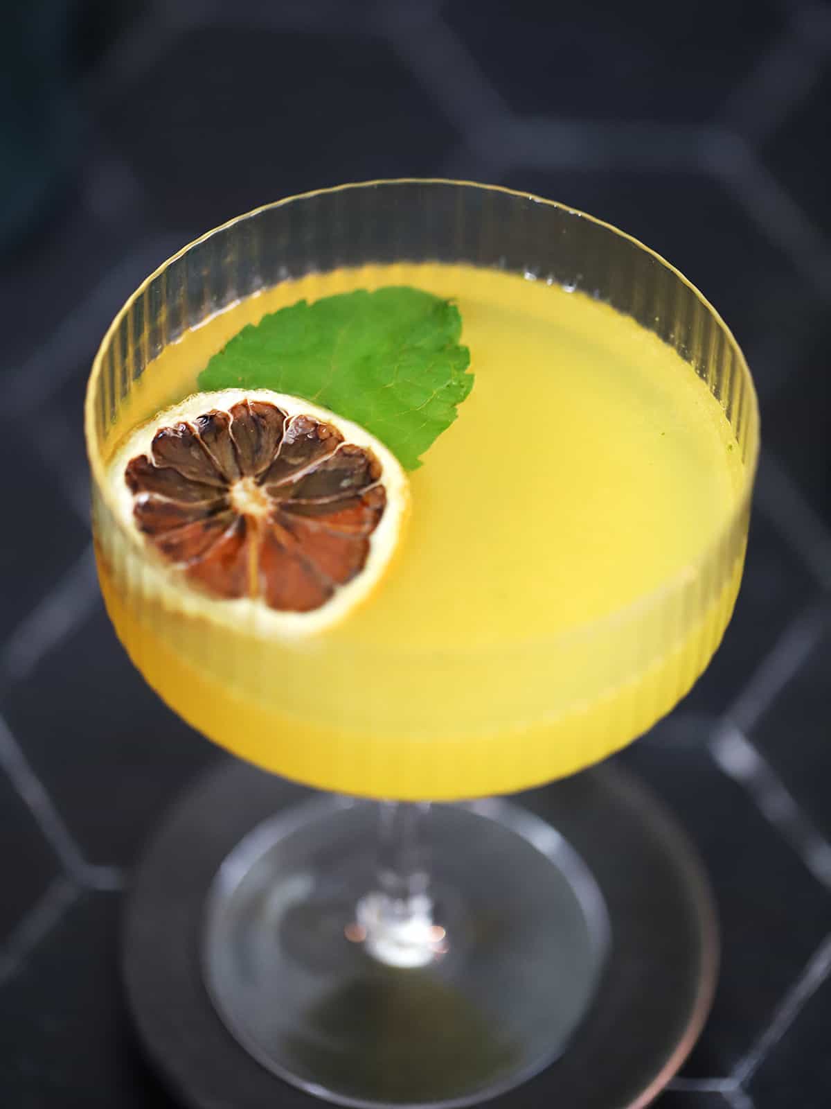 A glass of honey orange gin cocktail. 