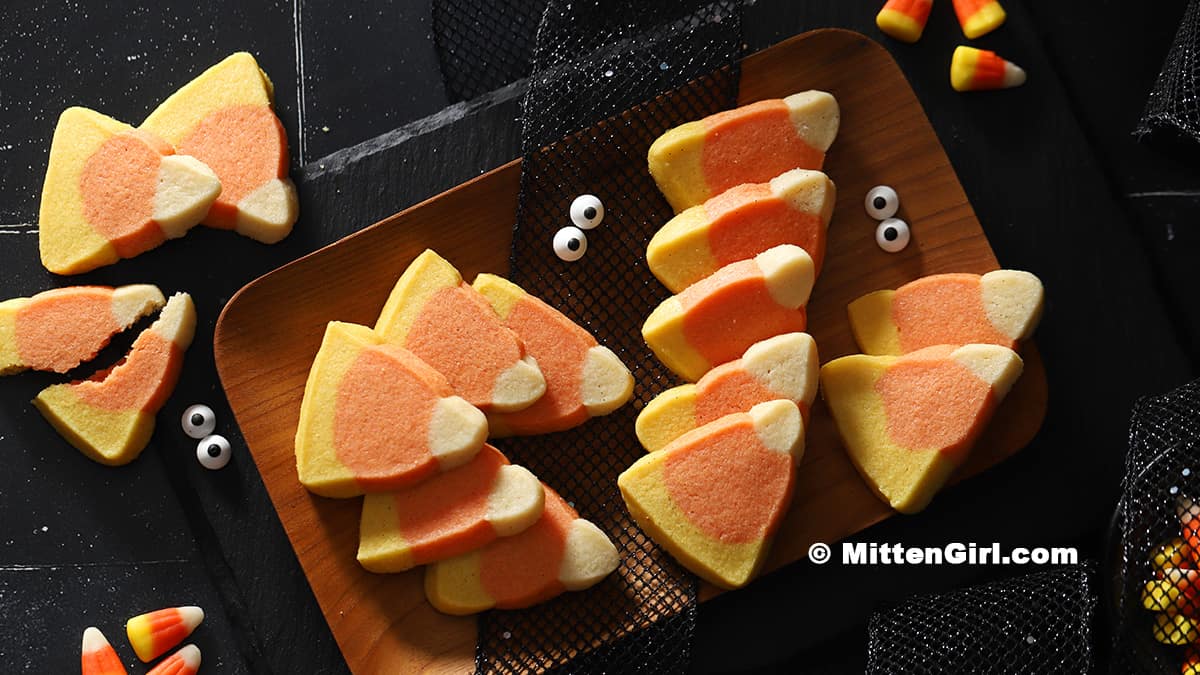 A tray of candy corn shaped shortbread cookies.