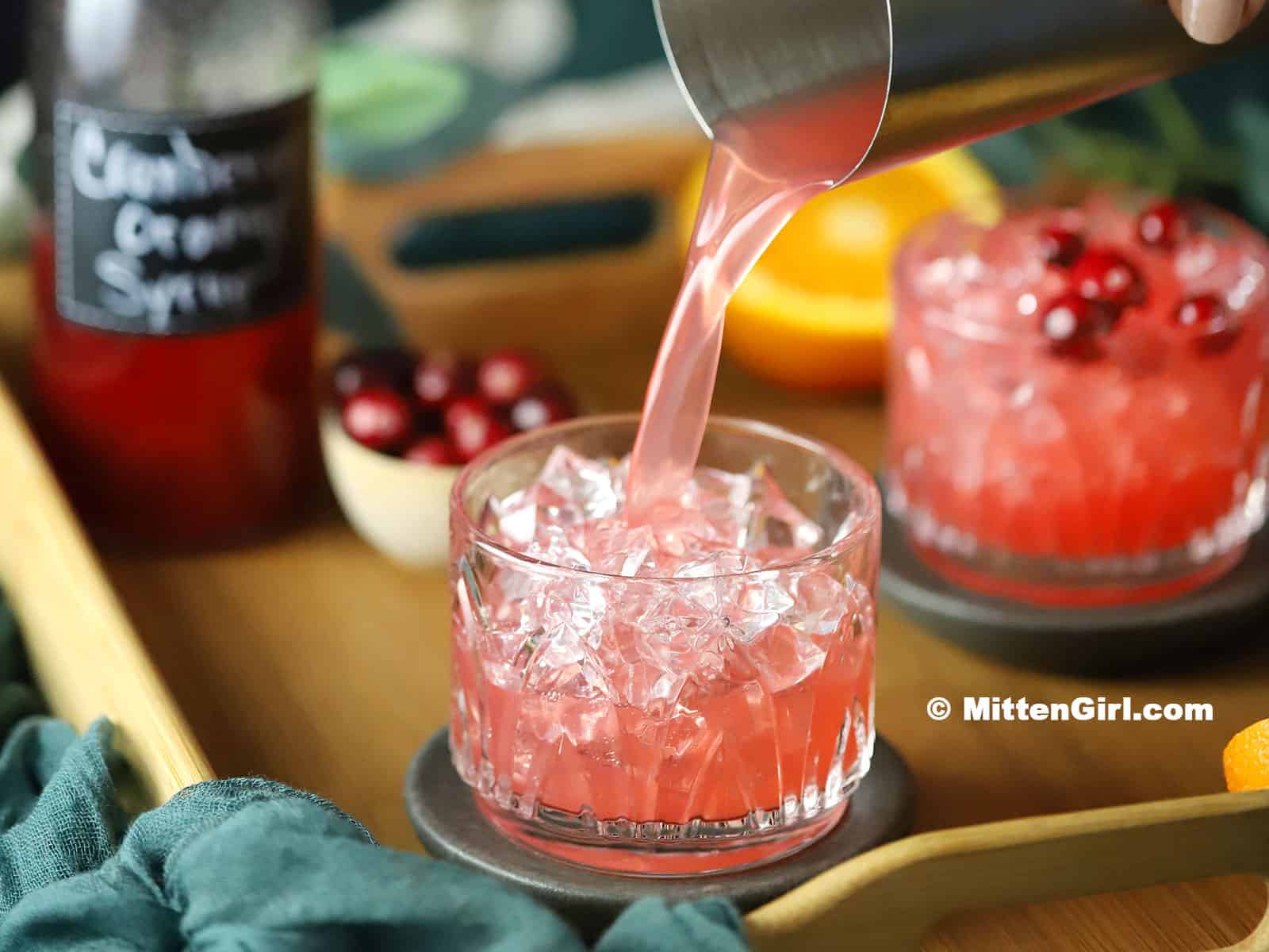 Pouring Cranberry Orange Mocktails