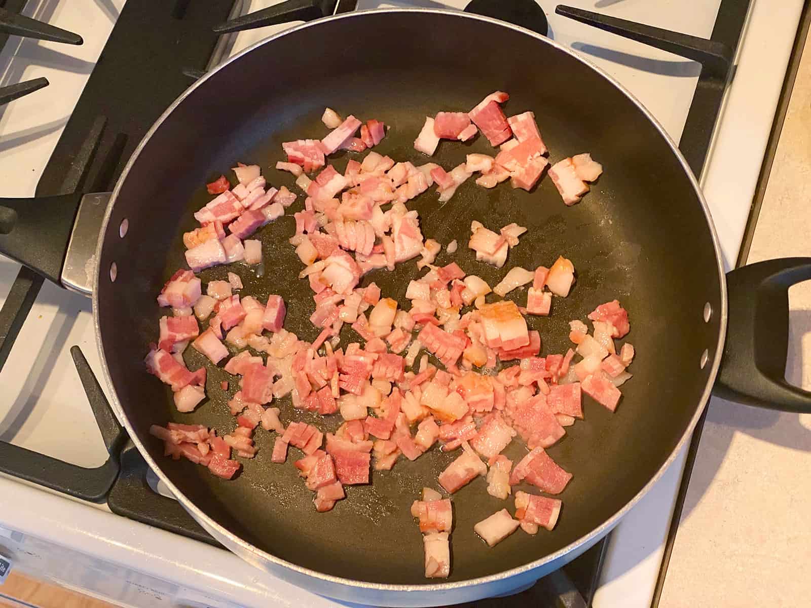 Bacon frying in a pan