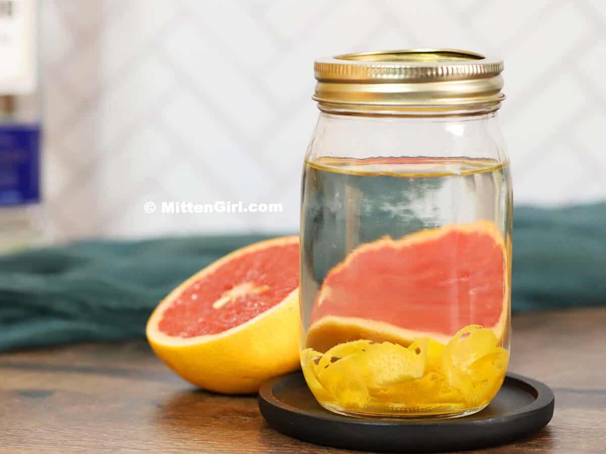 Grapefruit infused tequila in a jar.