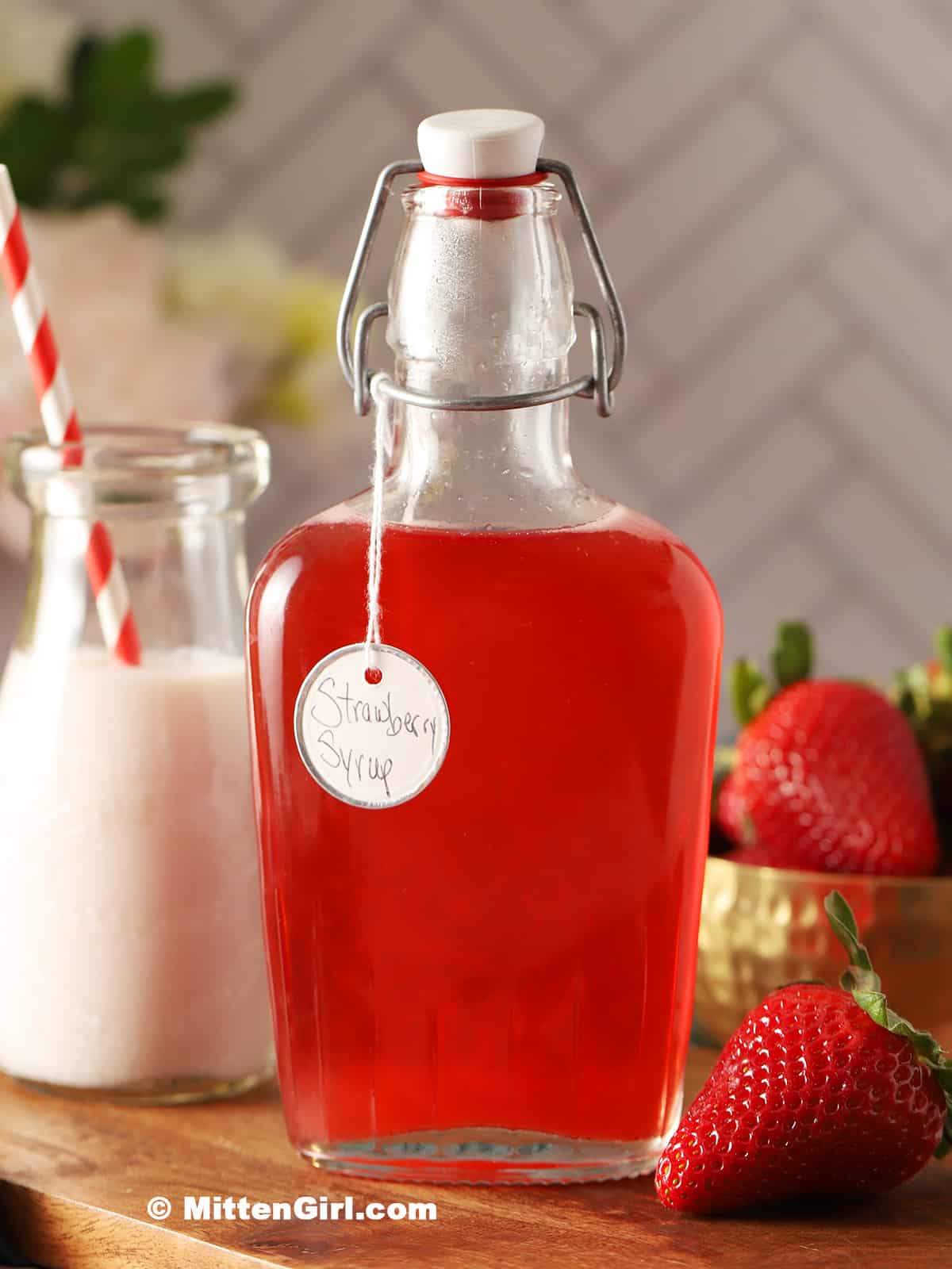 Strawberry Syrup in a glass bottle.