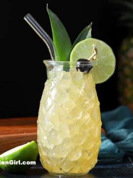 A Pineapple Mai Tai in a pineapple shaped glass.