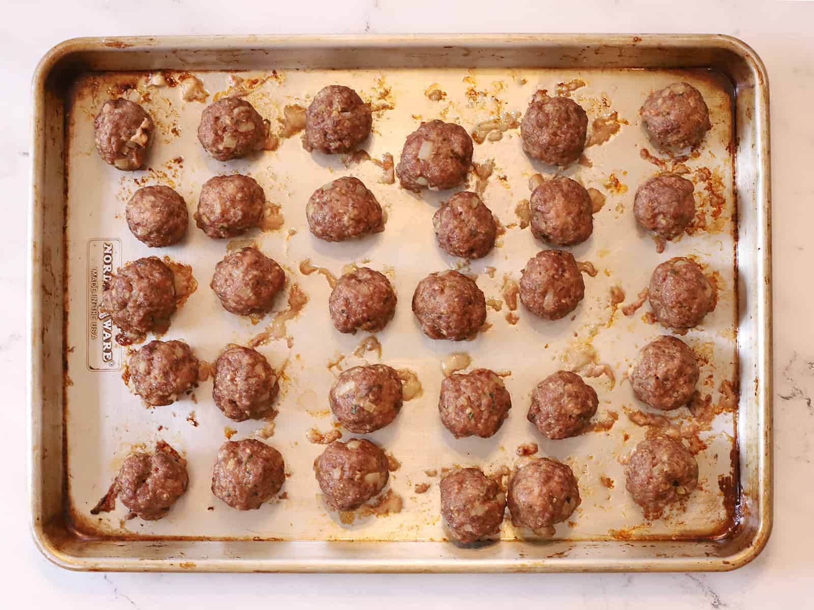 Cooked meatballs out of the oven.