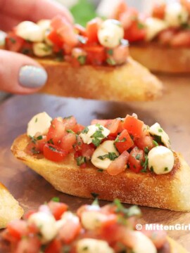 A tray of bruschetta mozzarella.