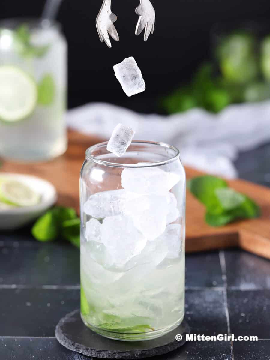 Ice falling into a glass.