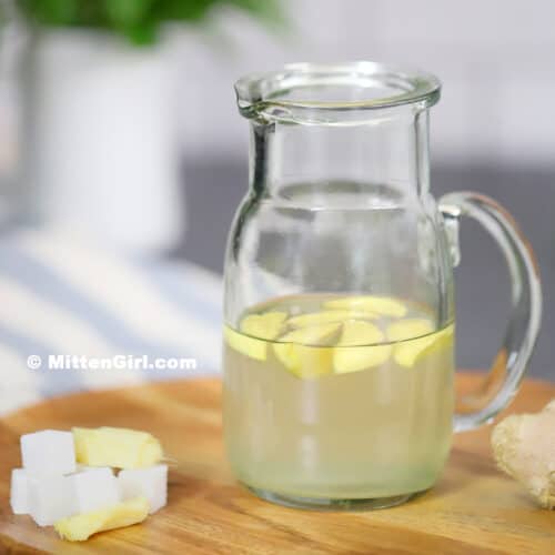 A small pitcher of ginger simple syrup.