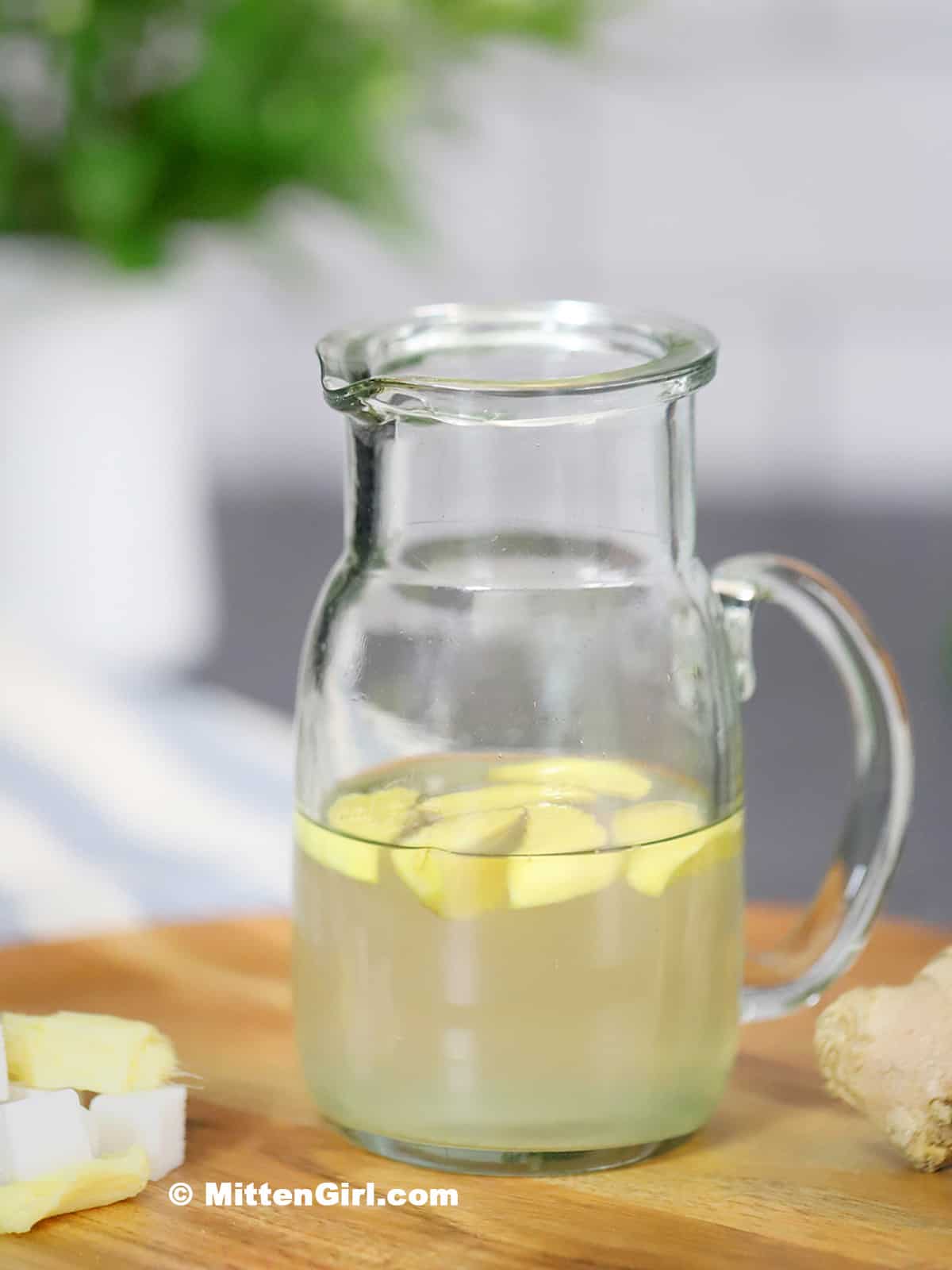 A small pitcher of ginger syrup.