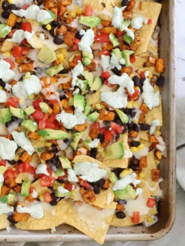 Looking down at a pan of vegetarian nachos.