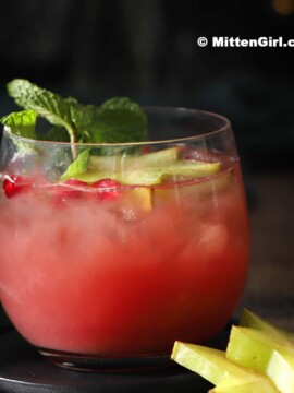 A glass of Pomegranate Christmas Punch.