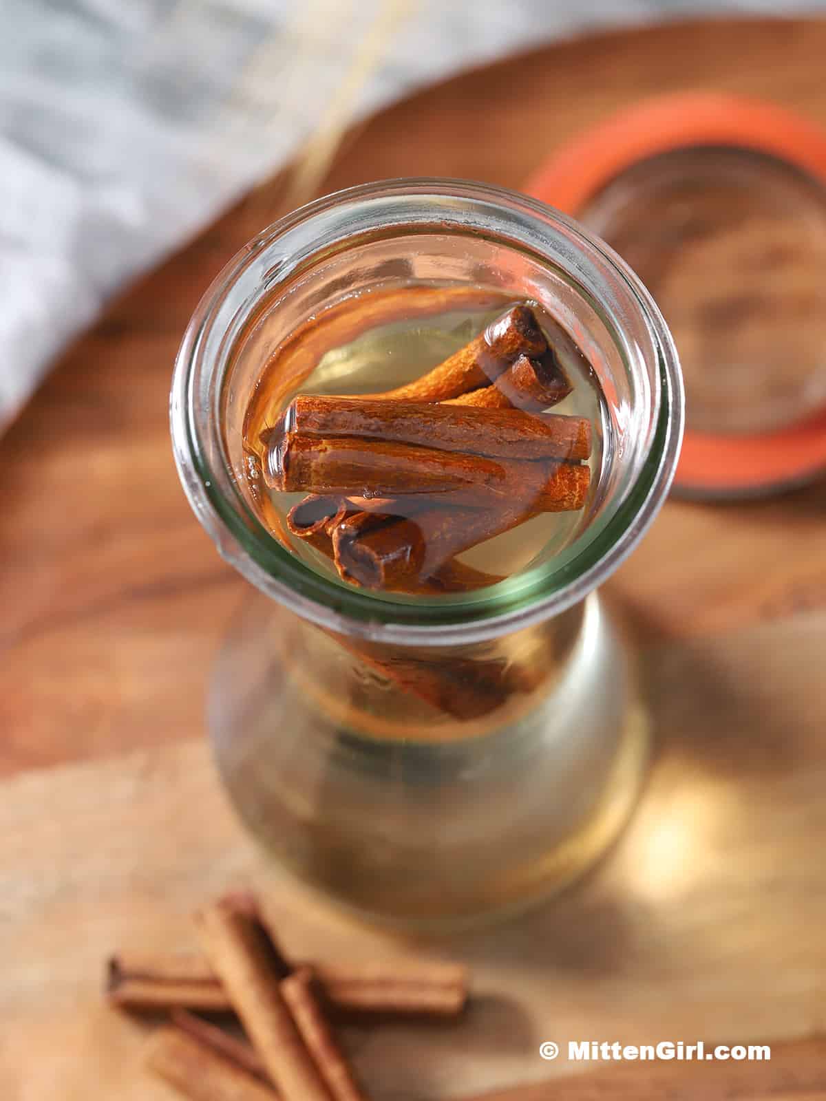 A jar full of cinnamon simple syrup.