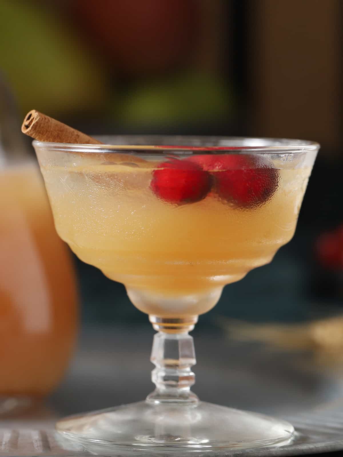 A glass of non-alcoholic apple cider punch.