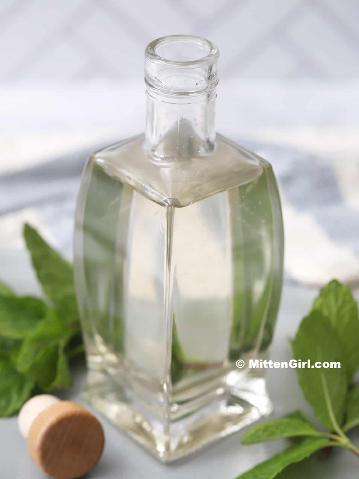 A jar filled with mint simple syrup. 