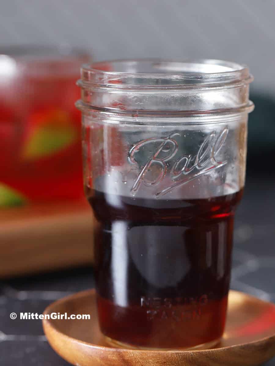 A jar of cherry vodka.