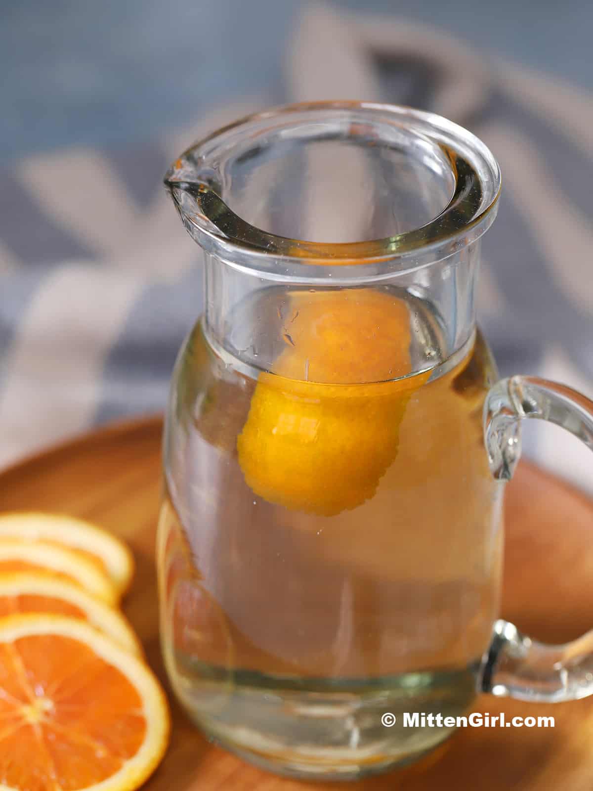 A pitcher of orange syrup.