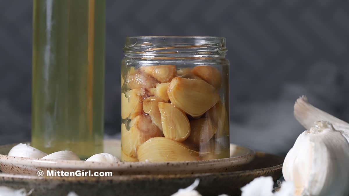 A jar full of roast garlic cloves.