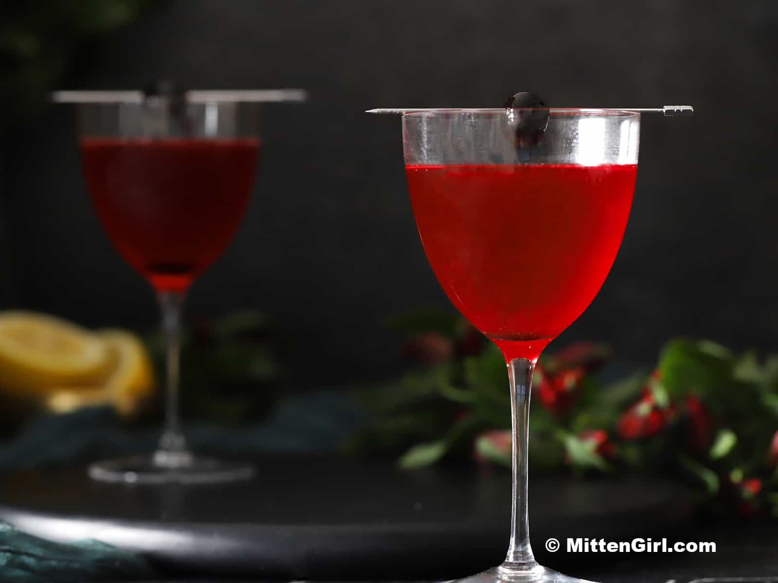 Glasses of cherry vodka sour cocktail.