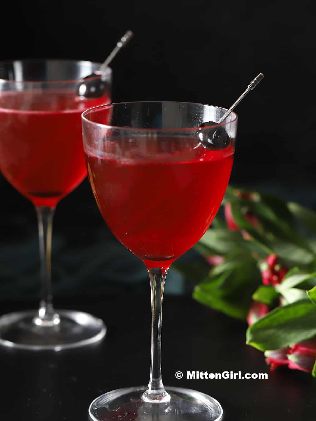 Glasses of cherry vodka sour cocktails. 