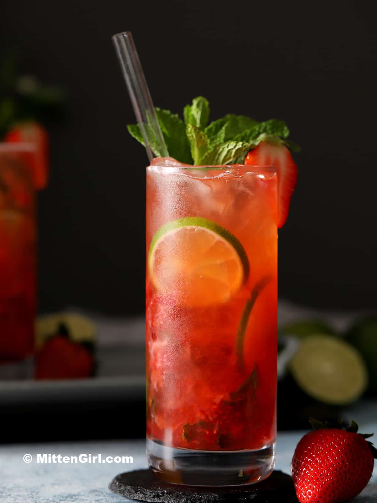 A glass of strawberry mojito mocktail.