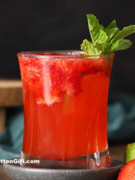 A glass of strawberry gin cocktail.