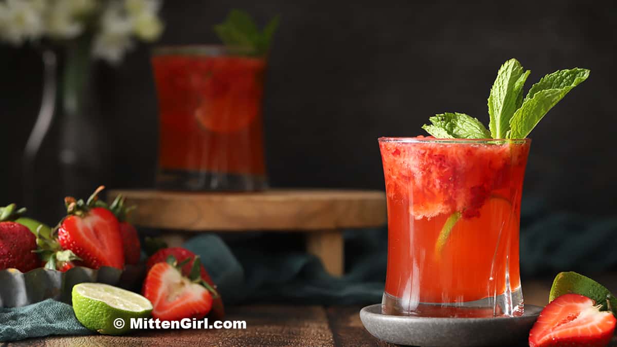 Glasses of Strawberry Gin Cocktails garnished with mint.