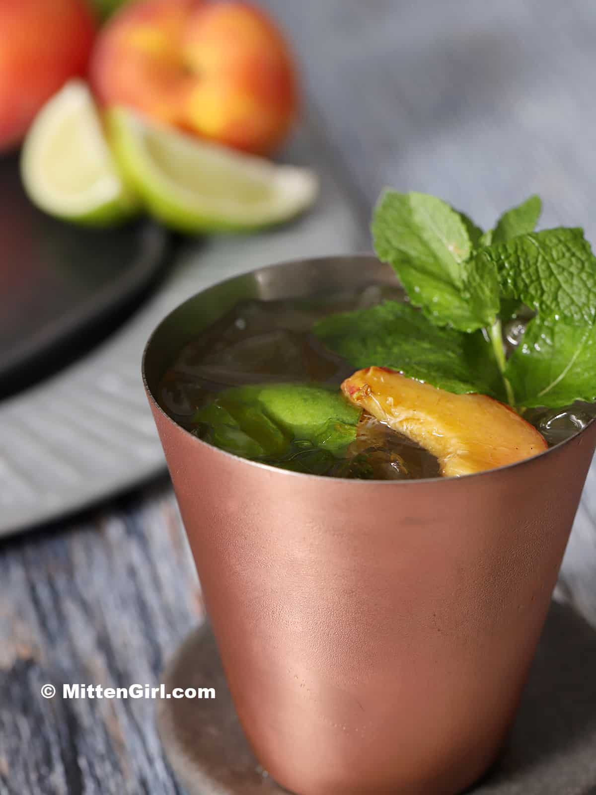 A copper cup of Peach Moscow Mule.
