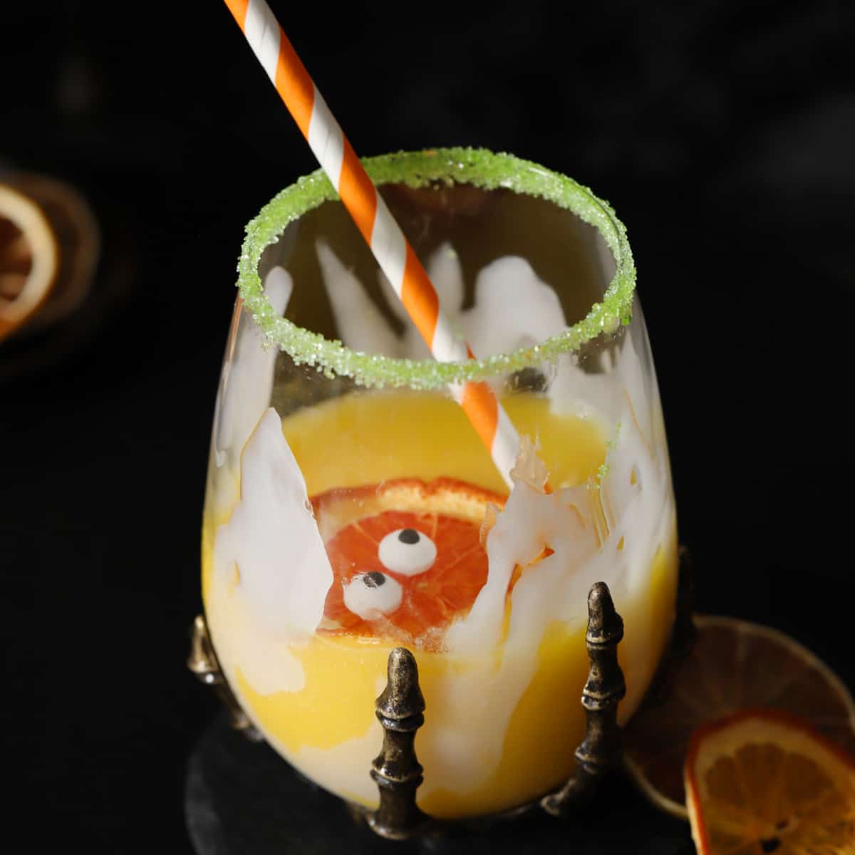 A glass of non-alcoholic Halloween drink.