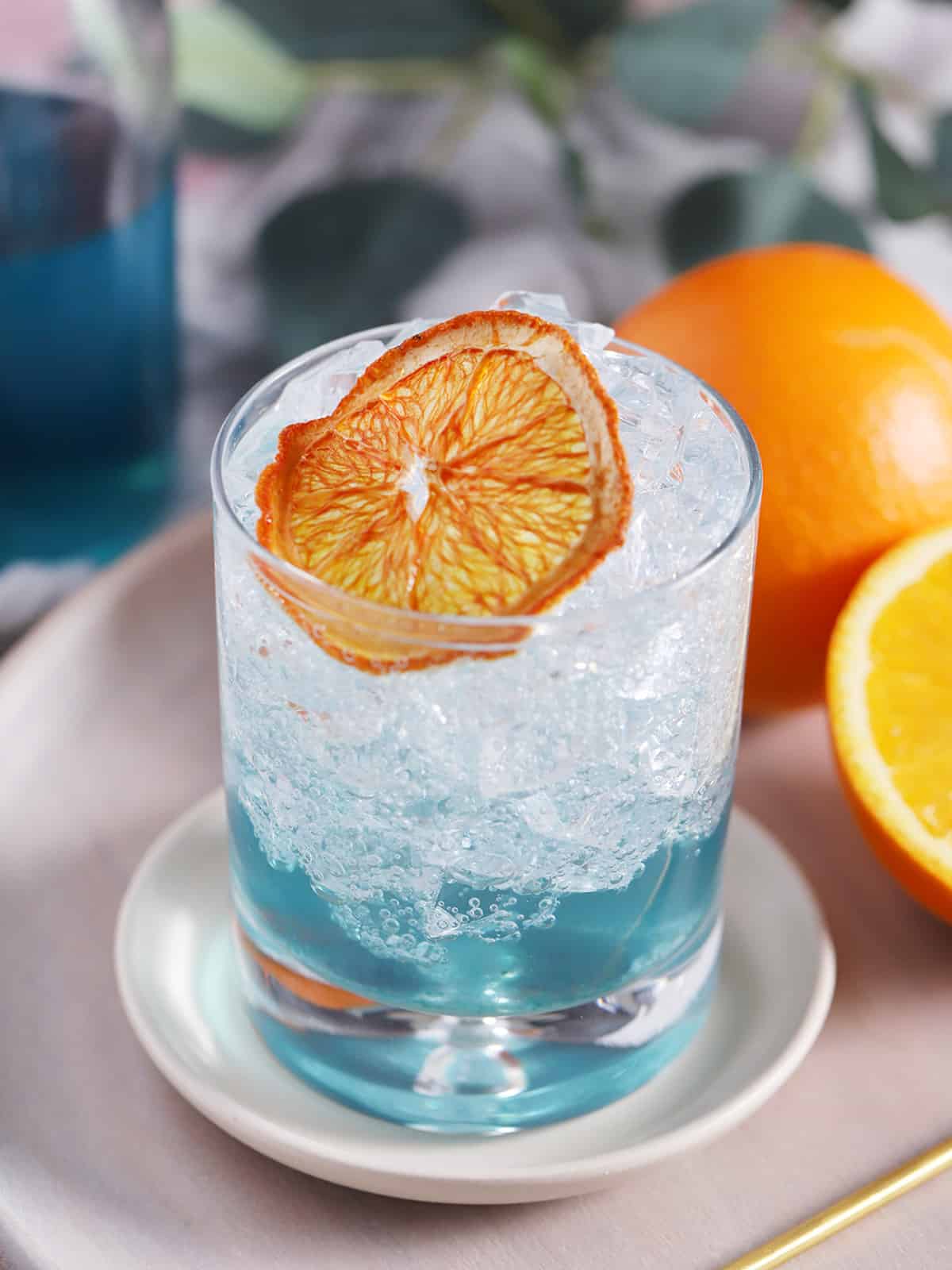 A drink made from  blue Curaçao syrup and club soda. 
