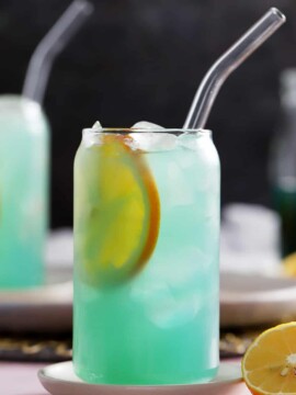 A glass of blue lagoon mocktail drink.