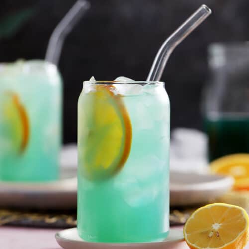 A glass of blue lagoon mocktail drink.