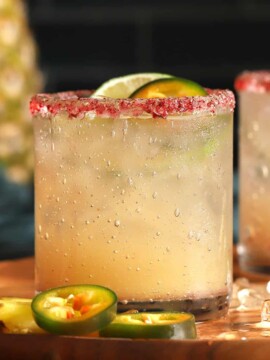 Glasses filled with spicy pineapple margaritas.