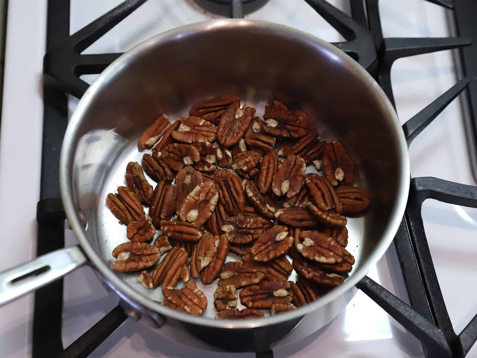 Pecans in a pot on the stove.