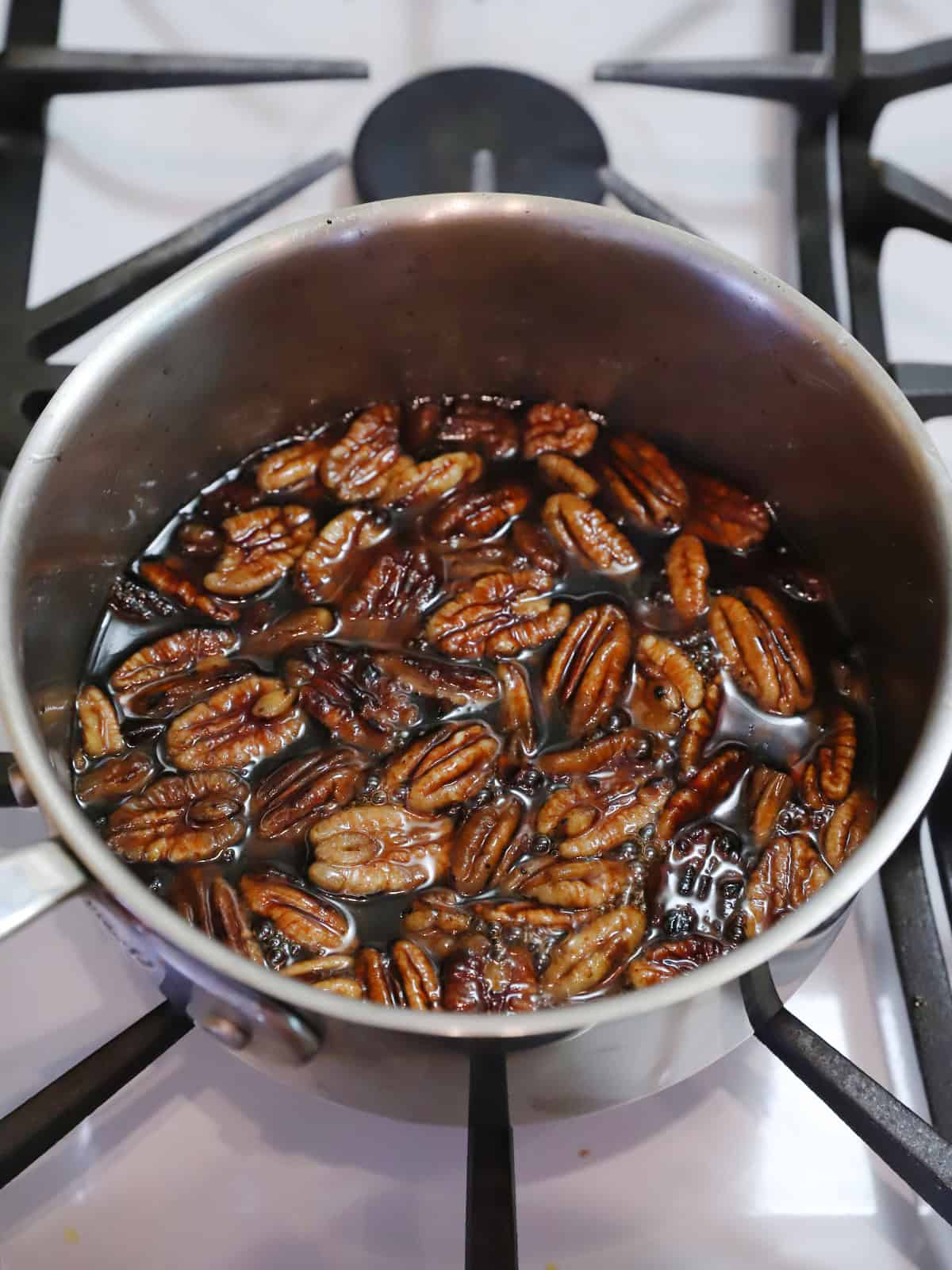Butter pecan syrup cooked on the stove, ready to sit and cool.